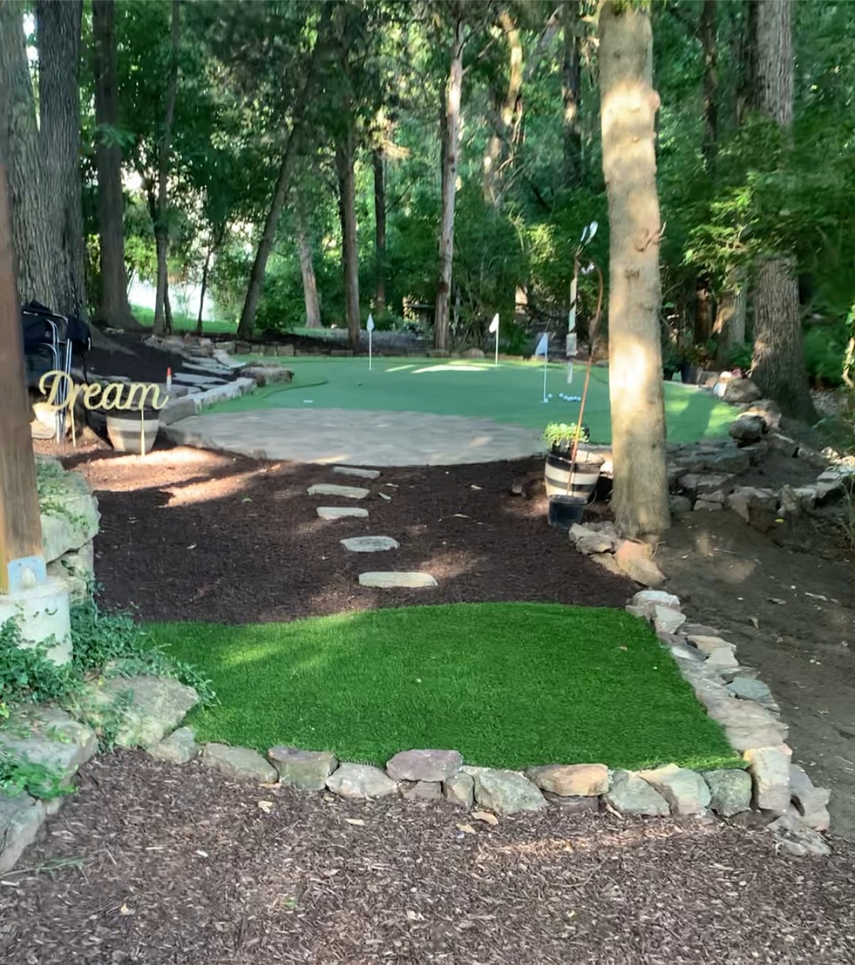 Dwyer National Golf Course — a lush backyard putting green surrounded by trees